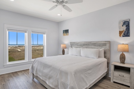Bedroom 2 on the 2nd floor with a queen bed, Gulf views, ceiling fan, TV and a private bathroom