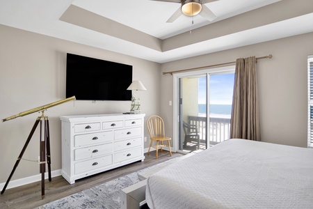 2nd floor primary bedroom has a TV and private bathroom and balcony