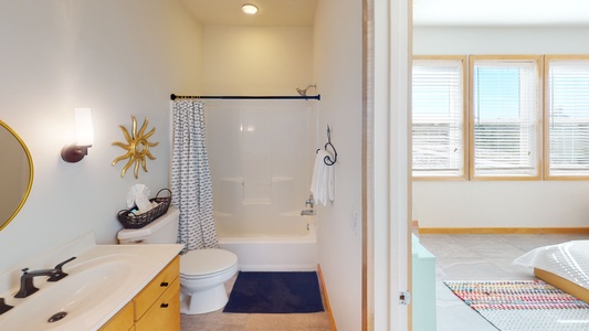 The private bath in bedroom (2) has a tub/shower combo