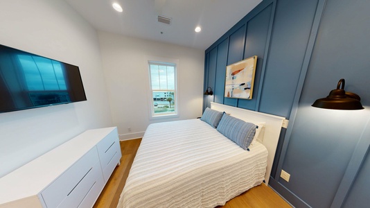 Bedroom #3 is on the 2nd floor with a queen bed, TV and private bathroom