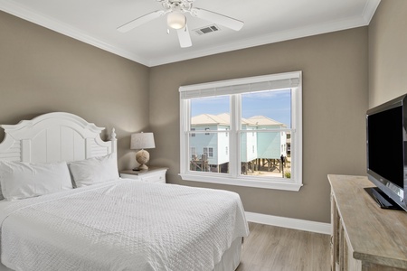 This bedroom offers a Queen bed and TV
