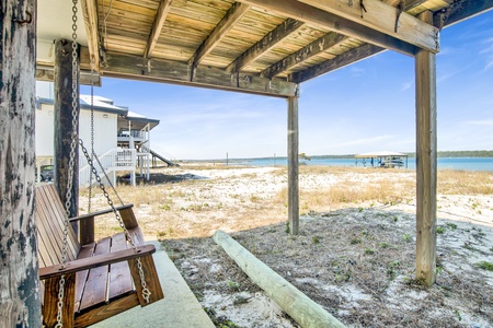 Covered swing under the home