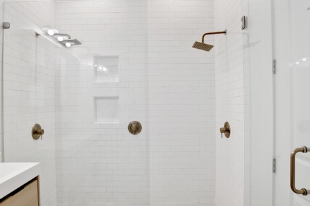 Featuring a walk-in tile shower