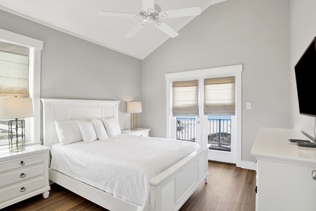 The guest bedroom has a Queen size bed, TV, balcony access and bathroom