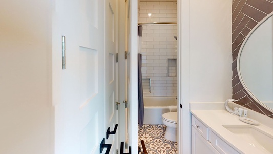 Bedroom #5, bathroom with a vanity and a tub/shower combo