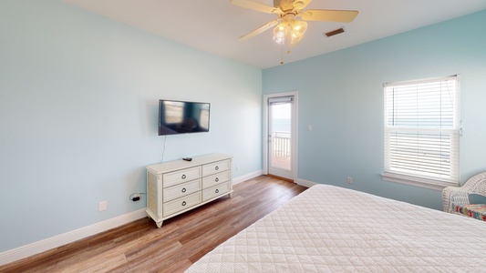 Second master bedroom(#7) features a king bed, TV with cable, access to the balcony with beach views and an attached, private bathroom