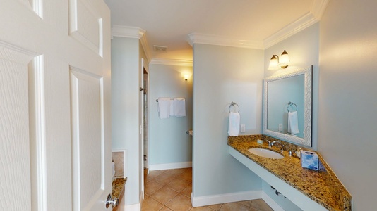 The private bath in bedroom 3 has a walk-in shower and a soaking tub- West