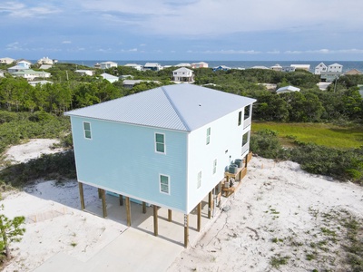 Home features electric car charging,covered dining, gas grill, golf cart storage and giant chess game