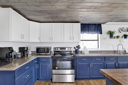The kitchen has been updated and offers stainless appliances