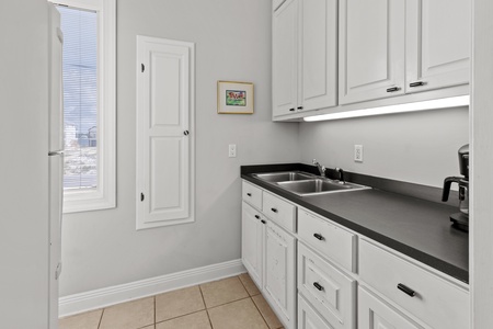 Sink in the laundry room located off of the kitchen