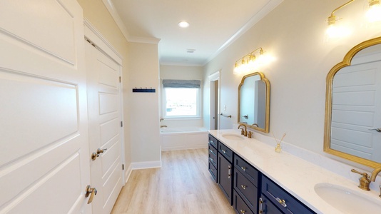 Master bath with double vanity, large tub and walk-in shower