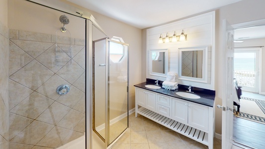 This 2nd floor bathroom has an entrance from bedroom 3 and the hall- it features a walk-in shower and a double vanity