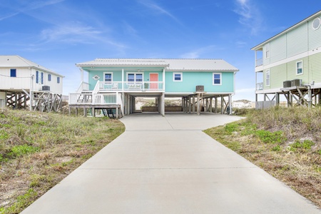 Covered parking and large paved driveway