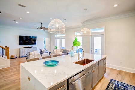 Quartz countertops and an enormous island in the kitchen