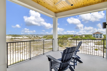 The covered balcony offers seating with views of the Little Lagoon