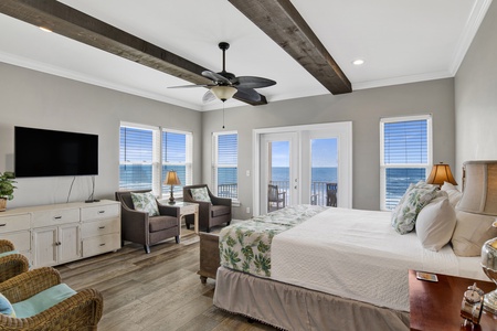 Bedroom 2 offers a private bathroom, TV and private balcony access