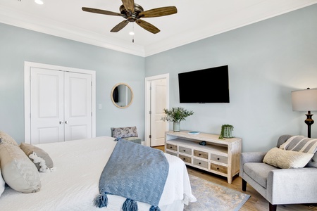 Bedroom 1 features a king bed and a television