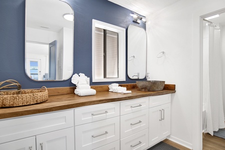 The shared bathroom is accessible from the master bedroom and hallway