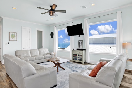 The living room offers a TV and half bathroom