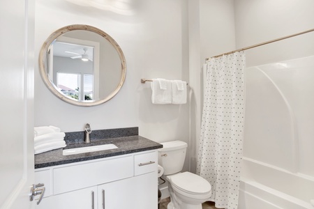 The private bath in Bedroom 6 has a tub/shower combo