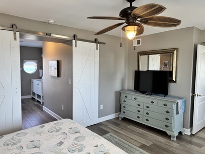 This bedroom has a King bed and TV