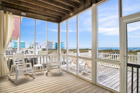 Screened in porch with views of the Beach