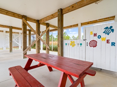 Shaded picnic table under home