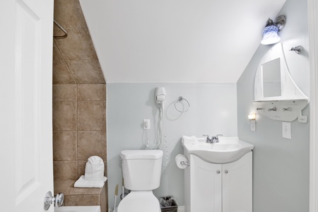 The Jack and Jill bathroom offers a tub/shower combo