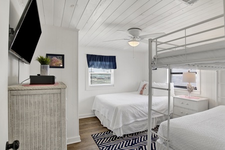 Bedroom 3 has a Queen bed and Twin Bunk