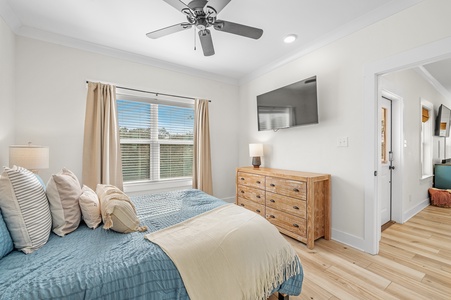 Bedroom 2 has a TV and a ceiling fan