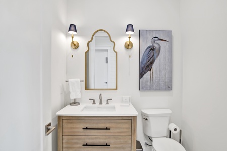 The half bath, is located in the hallway of the main living area