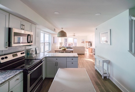 Newly updated kitchen with stainless appliances and stone countertops (A)