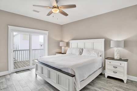 The Master bedroom boasts a king bed and deck access