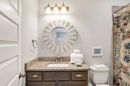 The private bathroom features a tub/shower combo