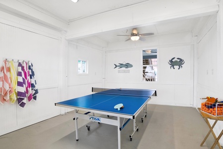 Downstairs game room with ping pong table