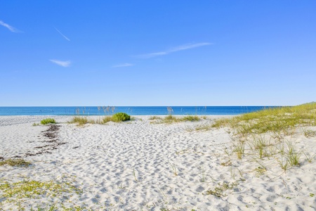 Enjoy the white sandy beaches of Fort Morgan right in front of the home