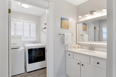 Off Master bedroom is a private bath and laundry room