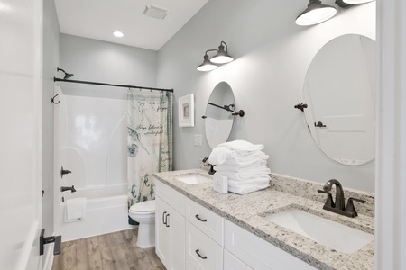 Private bath in Bedroom 3 with a tub/shower combo