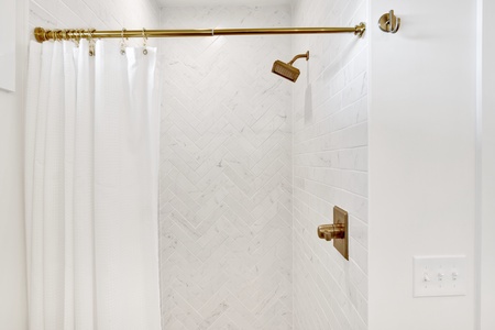 2nd floor SW bathroom 5 features a tile shower