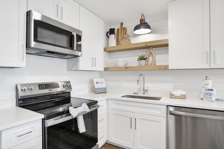Fully equipped kitchen with stainless appliances