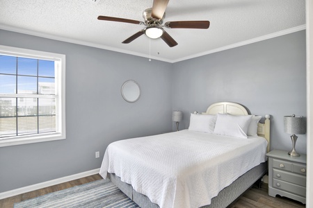 Guest bedroom 1 has a Queen size bed and TV