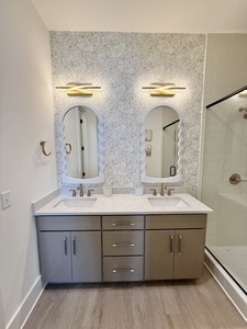 The private bathroom has dual vanities