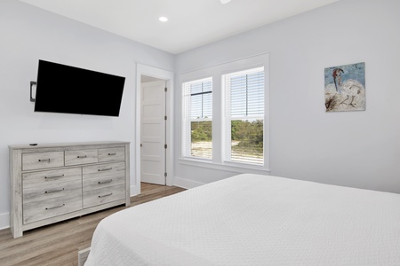 The master bedroom comes with a TV, ceiling fan and a private bathroom