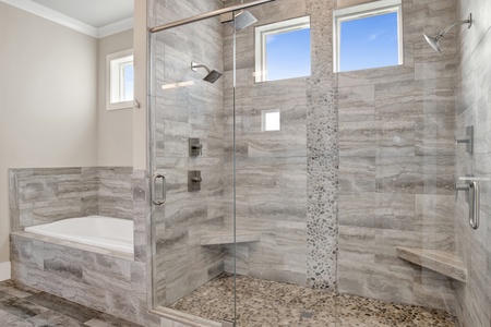 The master bath with a large tiled walk-in shower