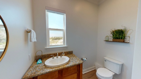 Powder room off the kitchen on the main level