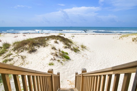 Access the balcony from the living room and walk right down to the beach