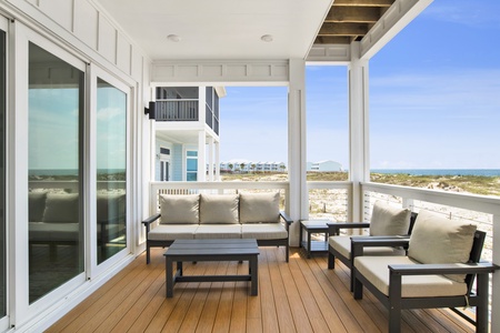 Comfortable seating under the covered porch, right off the dining room