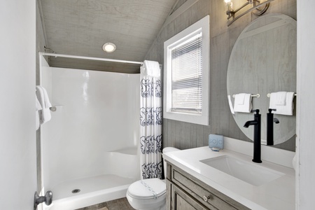 Upstairs loft full bathroom with a walk in shower