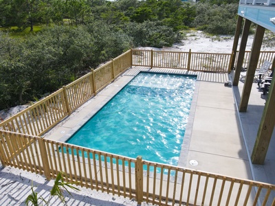 Large private pool with a secure fenced in area plus seating