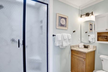 The hallway bathroom features a walk-in shower